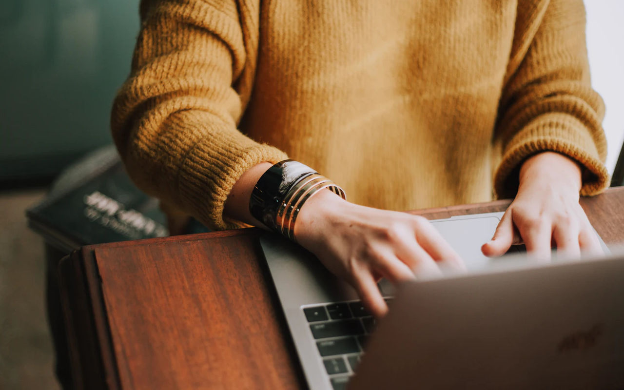 A person working on a laptop.